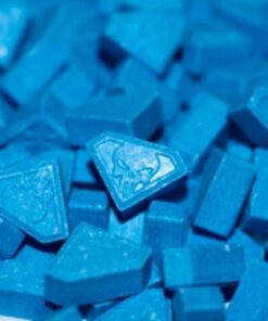 Blue Punishers MDMA Ecstasy Pills AAA+ (300mg). Round tablet commonly referred to as Punisher MDMA pill with skull logo imprint