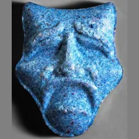 laugh now cry later MDMA pills. Tablet with ‘laugh now cry later’ theatrical mask imprint on surface”